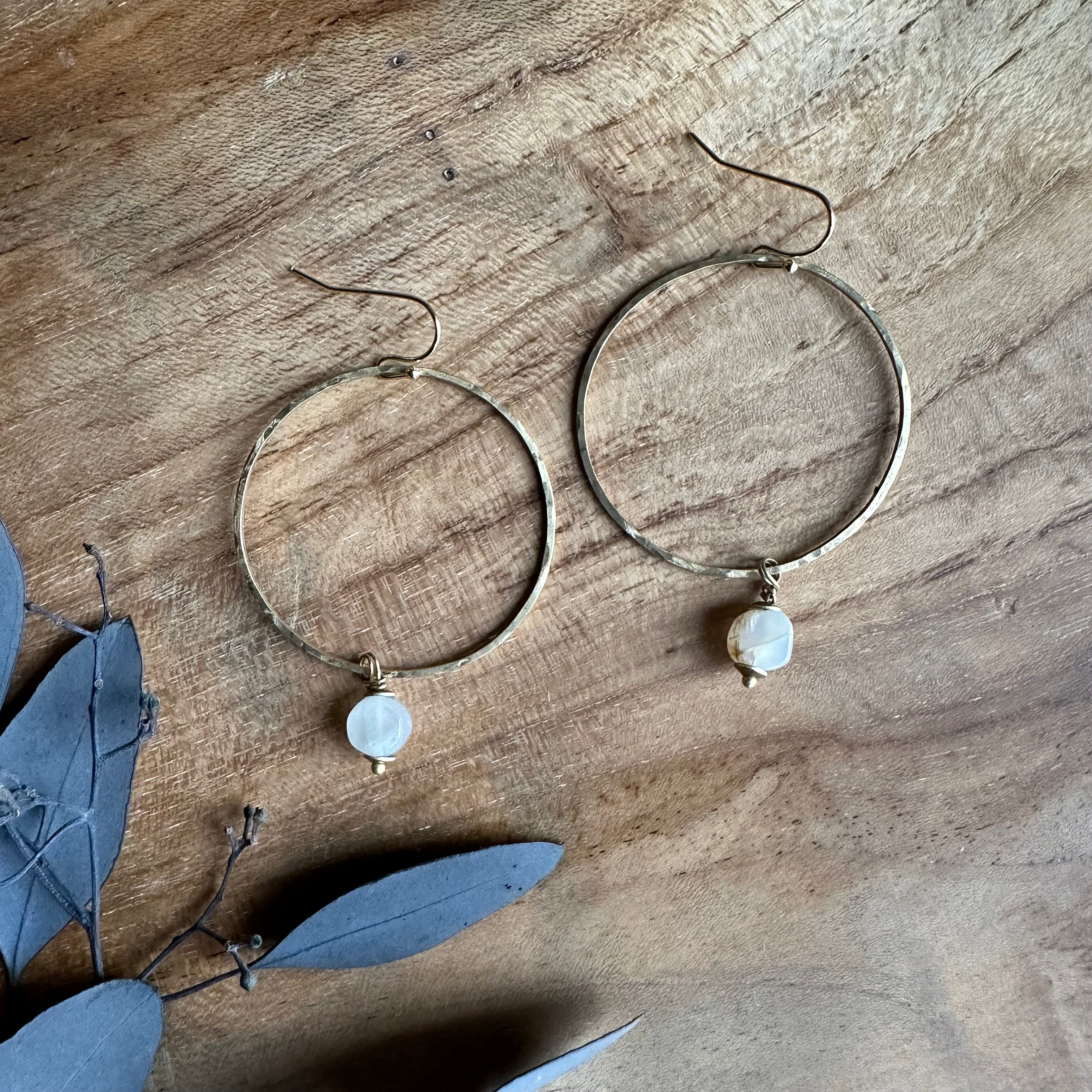 brass hand hammered hoops with moonstone